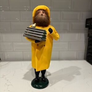 Byers Choice vintage Fisherman in yellow coat with lobster trap.
